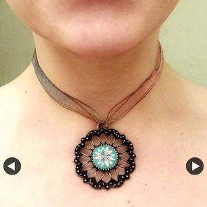 Ribbon choker with metal flower charm geometrical